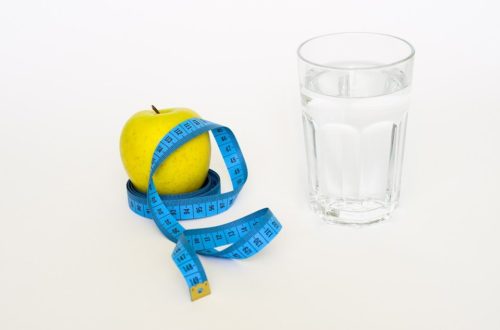 Benefits of Drinking More Water For Weight Loss -Glasses of water and measuring tape