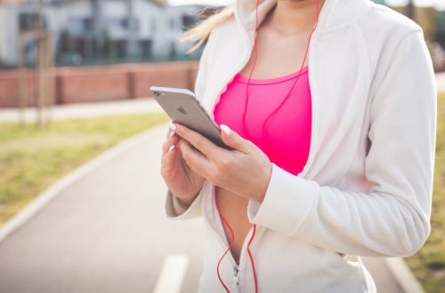 Woman in active wear with phone