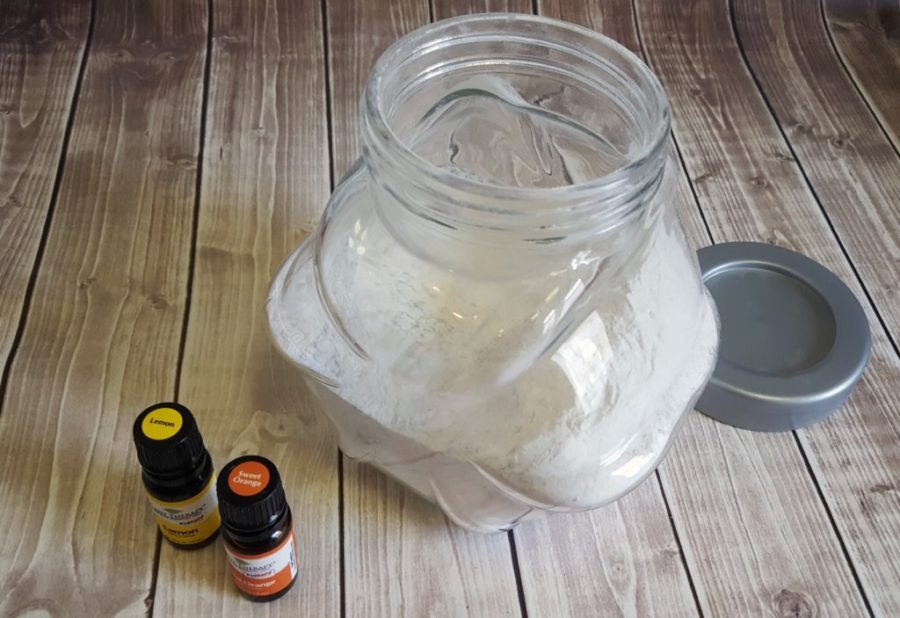 Jar with baking soda and 2 bottles with essential oils