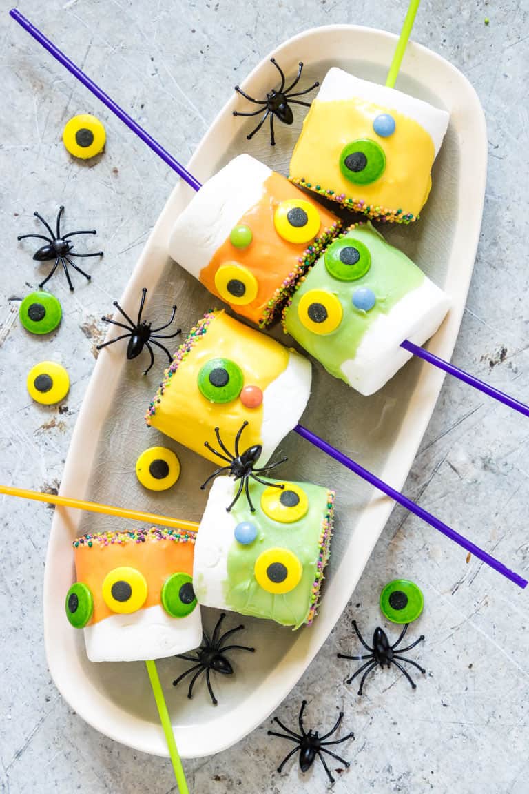 Halloween Marshmallow Pops and spiders on a plate