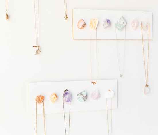 necklaces hanged on a crystal necklace display