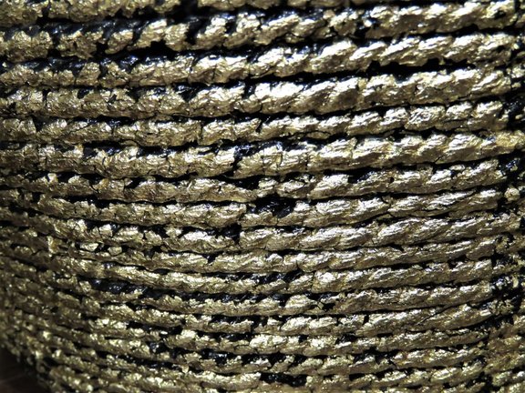 closeup of gold foil applied on rope basket after sealing