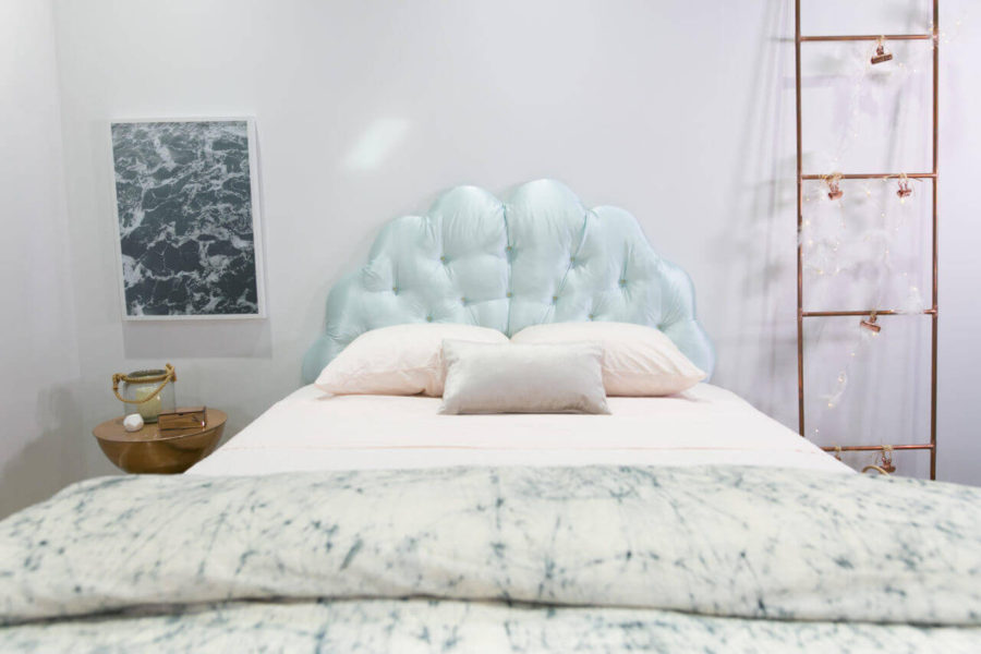 white bed with mermaid shell headboard