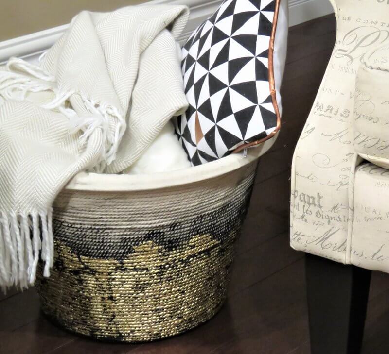 DIY Metallic Rope Basket filled with blankets and pillows