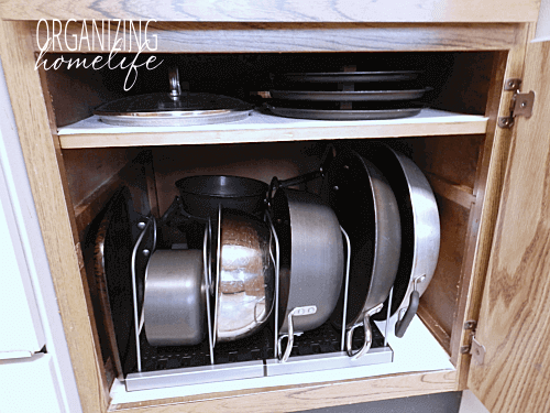 Pots and pans organized in a cupboard