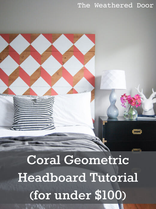Grey bed with coral and white geometric headboard