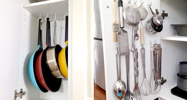 Pots hanging in cabinet