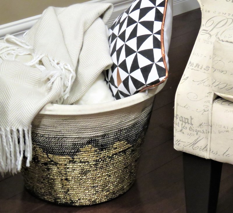 DIY rope basket filled with blankets and pillows